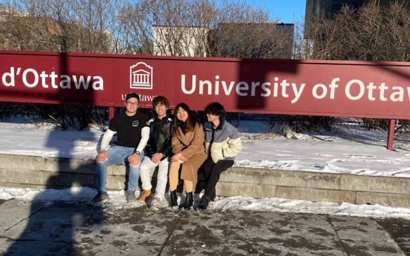 students posing in front of uottawa entrance