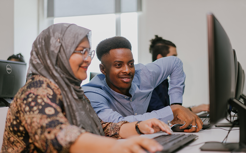 Taylor's lecturer guiding student on the assignment