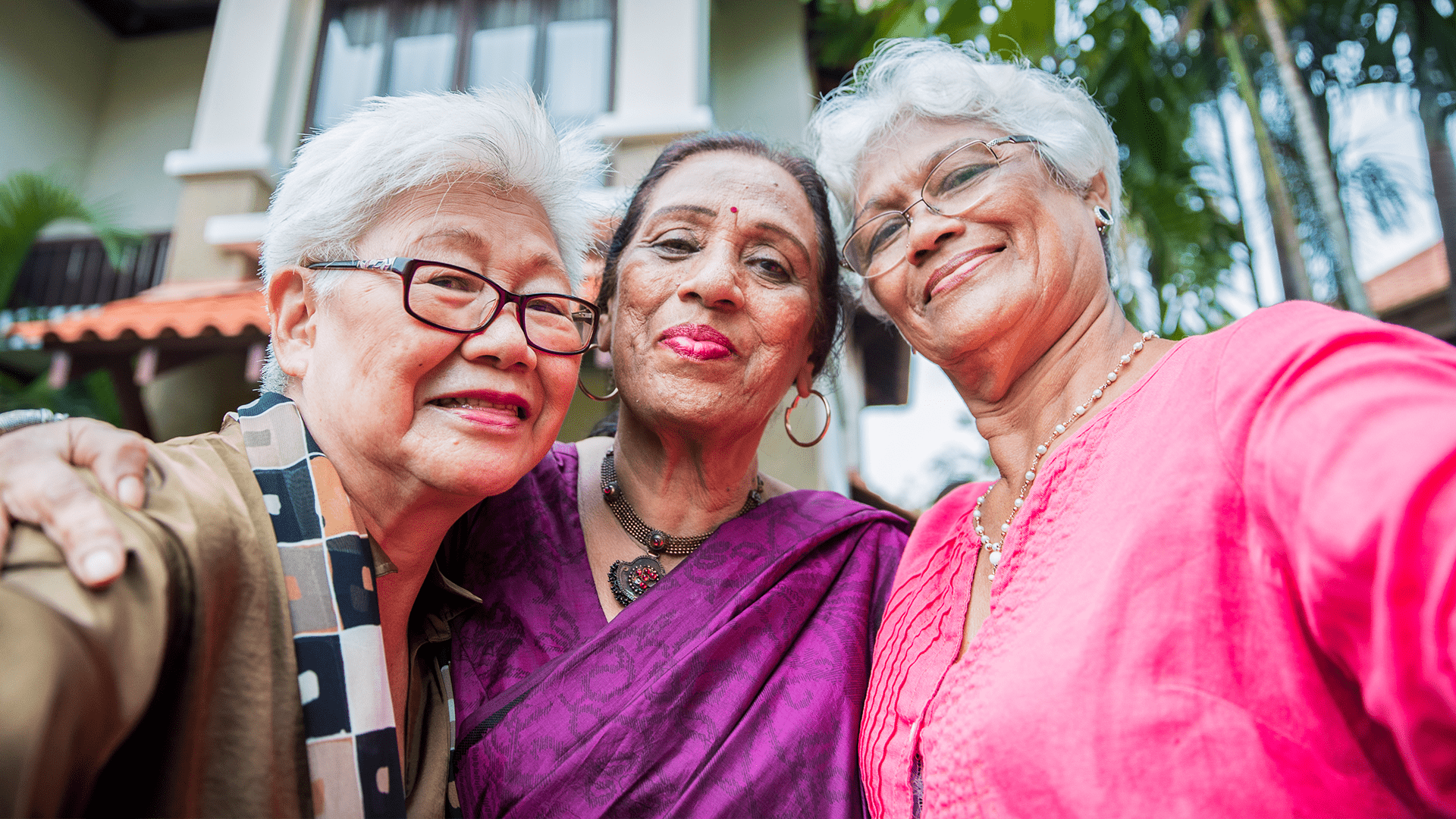 Retired asian women taking a group picture together