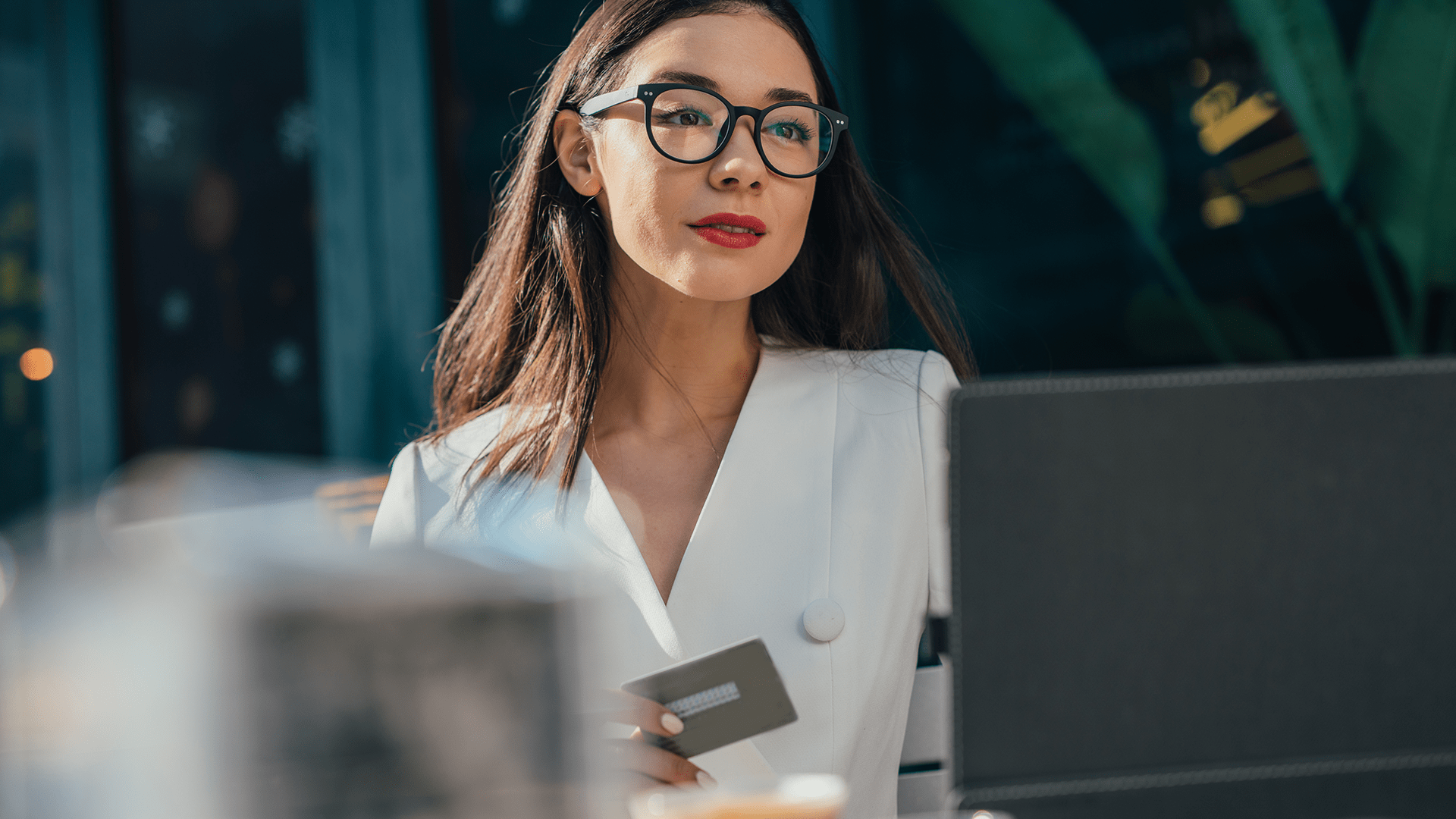 Young business woman focusing on the computer screen