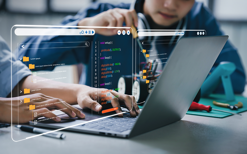 Student coding on a computer