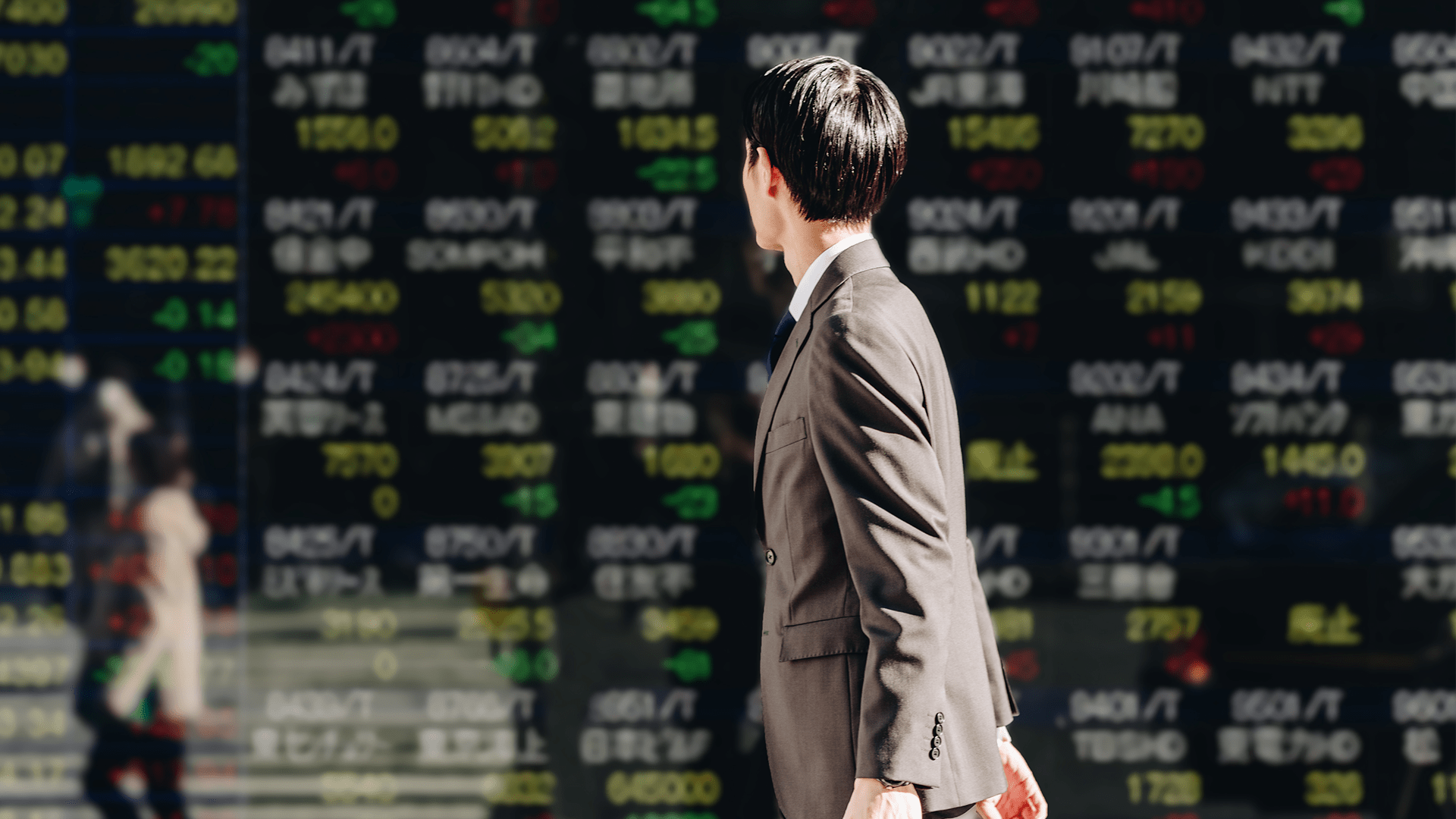 Young asian guy looking at the display board