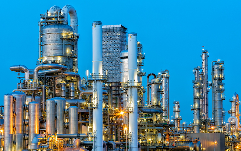 A large, modern petrochemical plant at dusk in industrial district near Rotterdam, Netherlands, Benelux, Europe