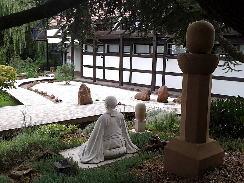 Sculpture of Zen master Taisen Deshimaru in the Zen garden of the temple Kosan Ryumonji