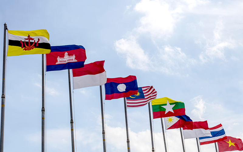 National flags of countries who are member of AEC (ASEAN economic community) on blue sky background