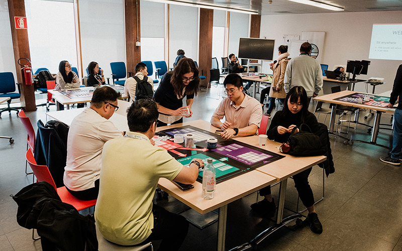 Participants actively collaborating during a hands-on workshop at Kilometro Rosso Innovation District, a highlight of the study tour, focused on fostering innovative thinking and inter-generational family business development.