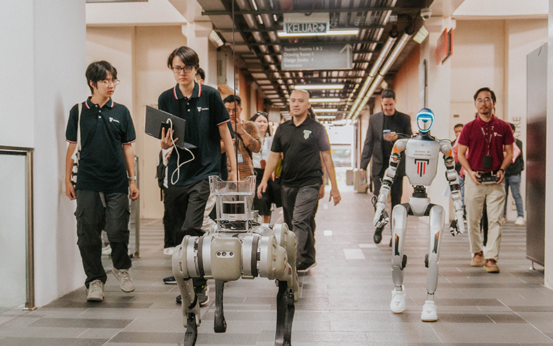 Big Robodog B1 and Humanoid G1 guiding the media through the experiential journey.