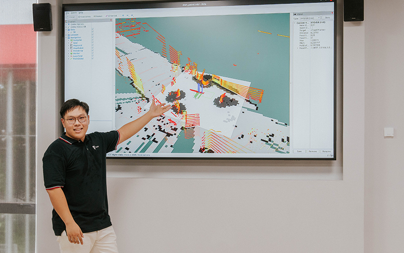 Ng Ee Zhen, President of Robotics Club, demonstrating AI-driven real-time data for the Obstruction Encounter system, illustrating how students are trained for real-world challenges like search-and-rescue missions.
