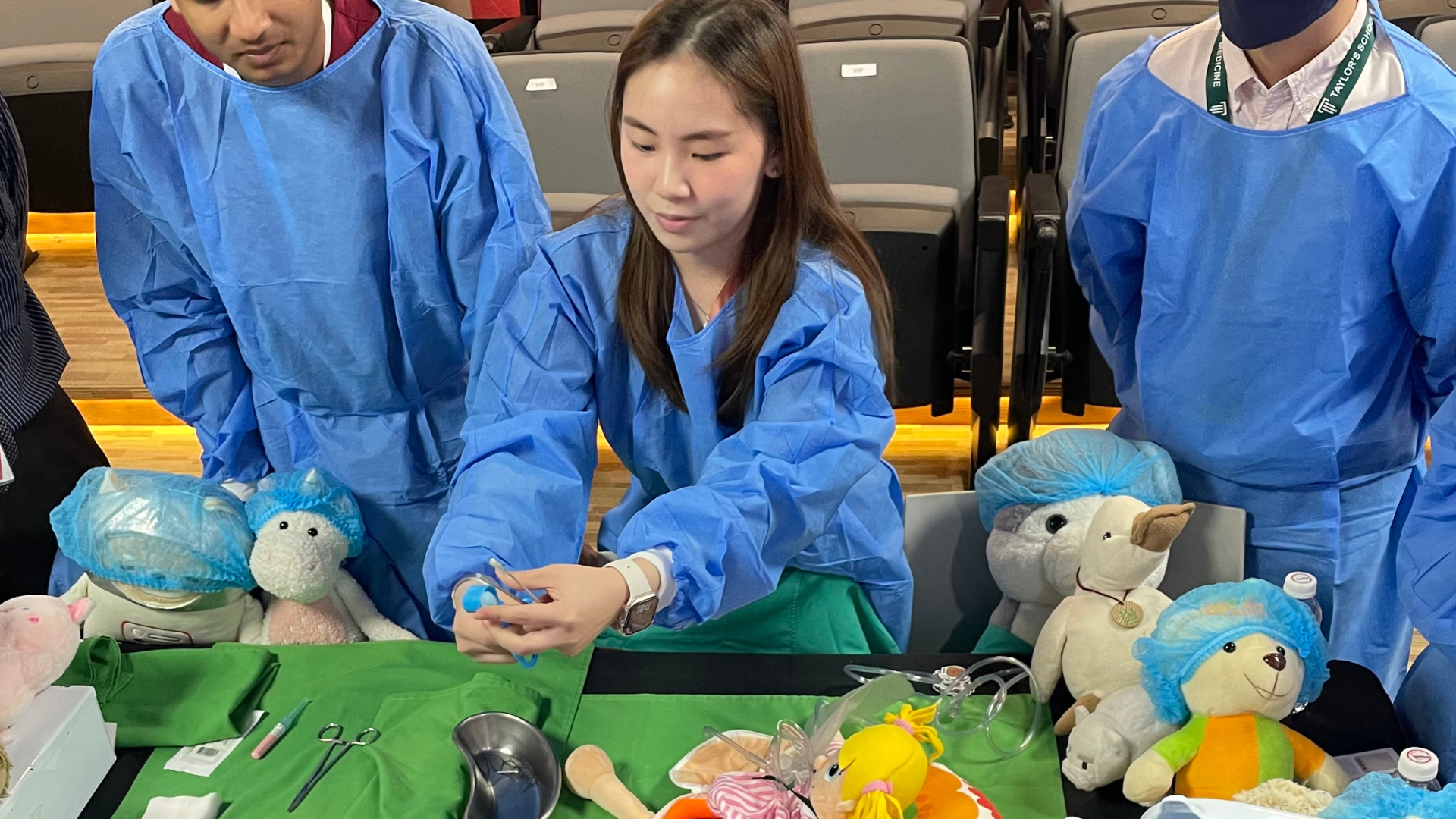 academic demonstrating medical theories through teddy bear