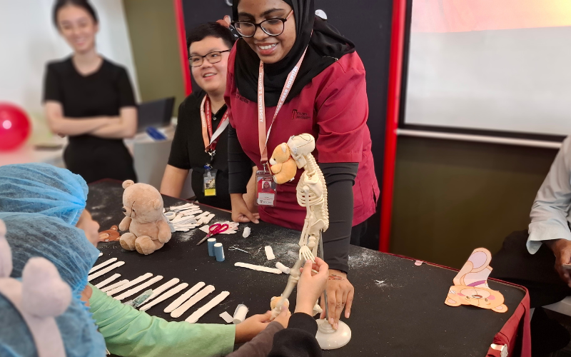 lecturer demonstrating to student