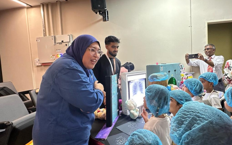lecturer giving a talk to children