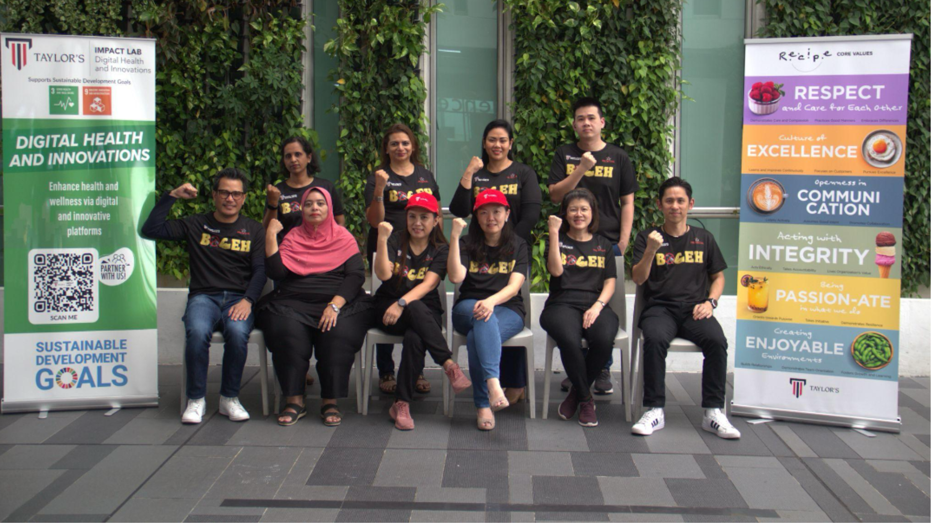 group of impact labs individuals pose seated