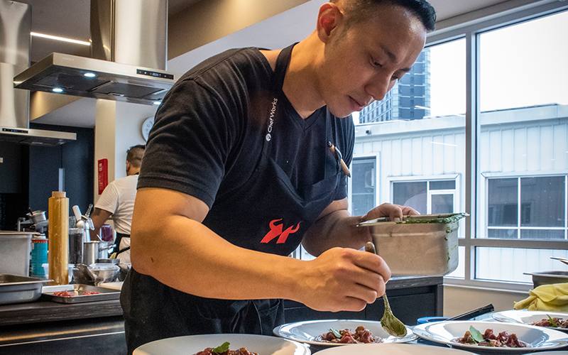 Chef Yuda Bustara plating a dish during the filming of The Maverick Academy, where he earned the title ‘Top Scholar’.