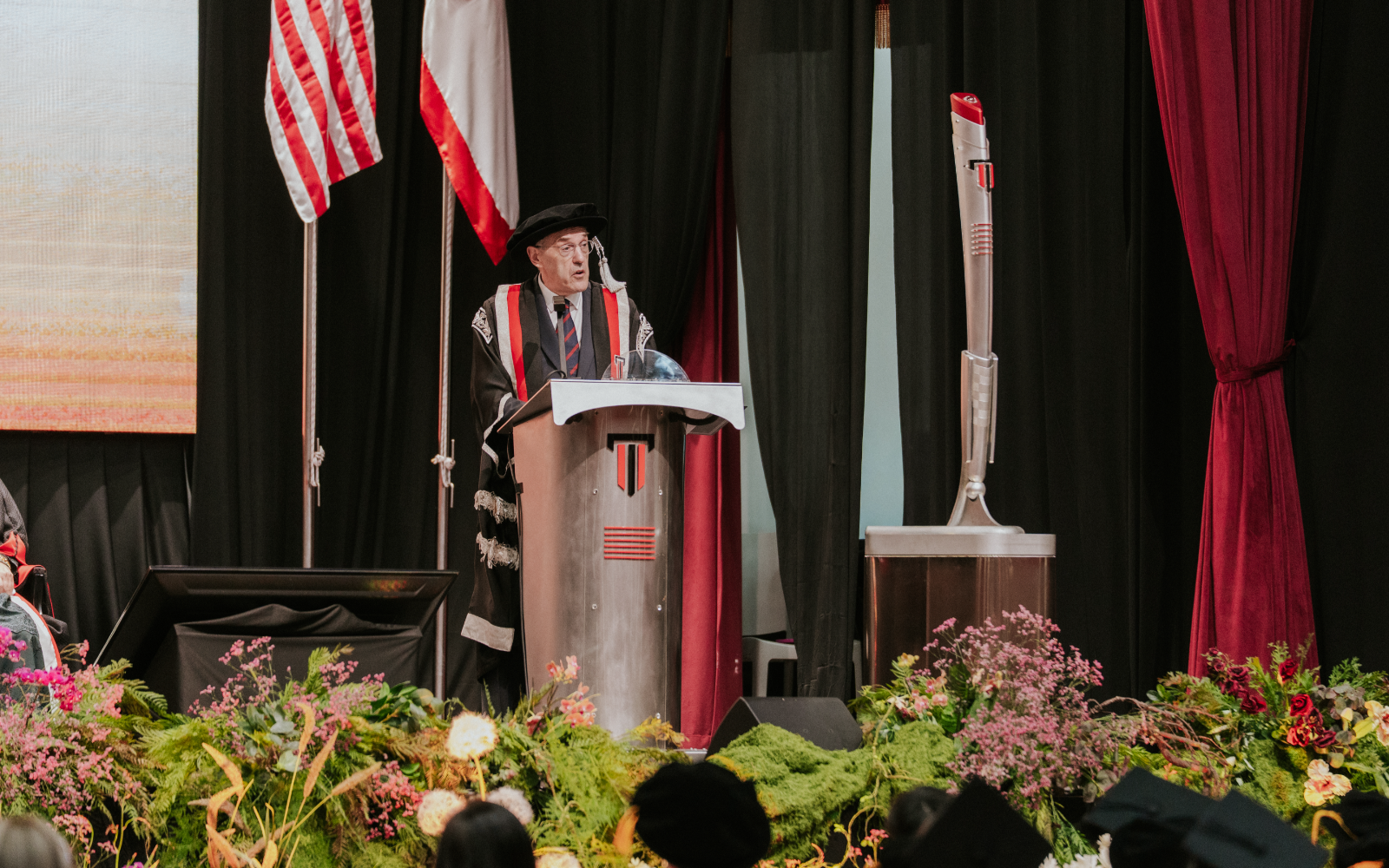 Taylor's University Vice-Chancellor Professor Barry Winn giving speech on the stage in the grand hall