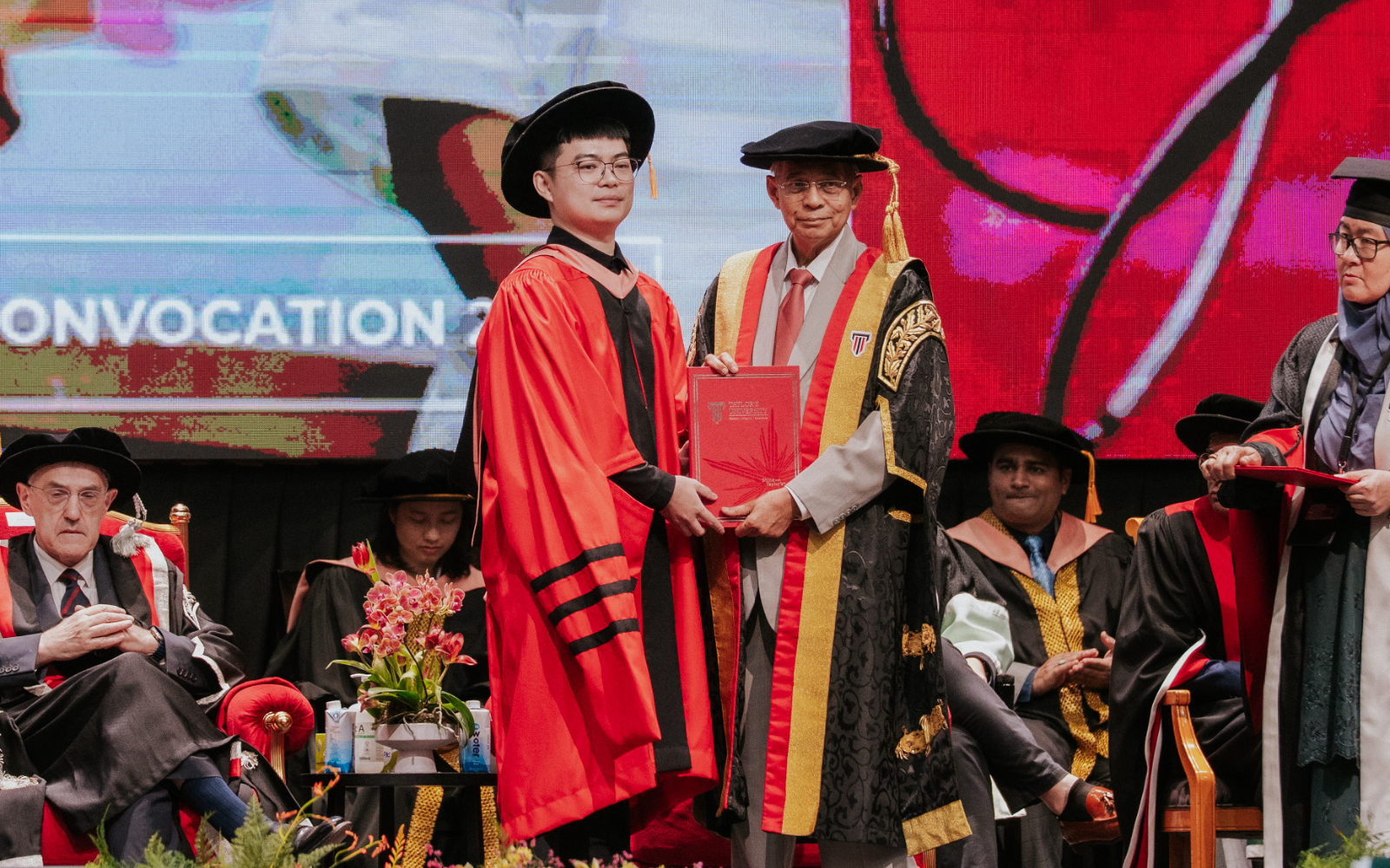 Graduation receiving awards from Chancellor Prof Hassan