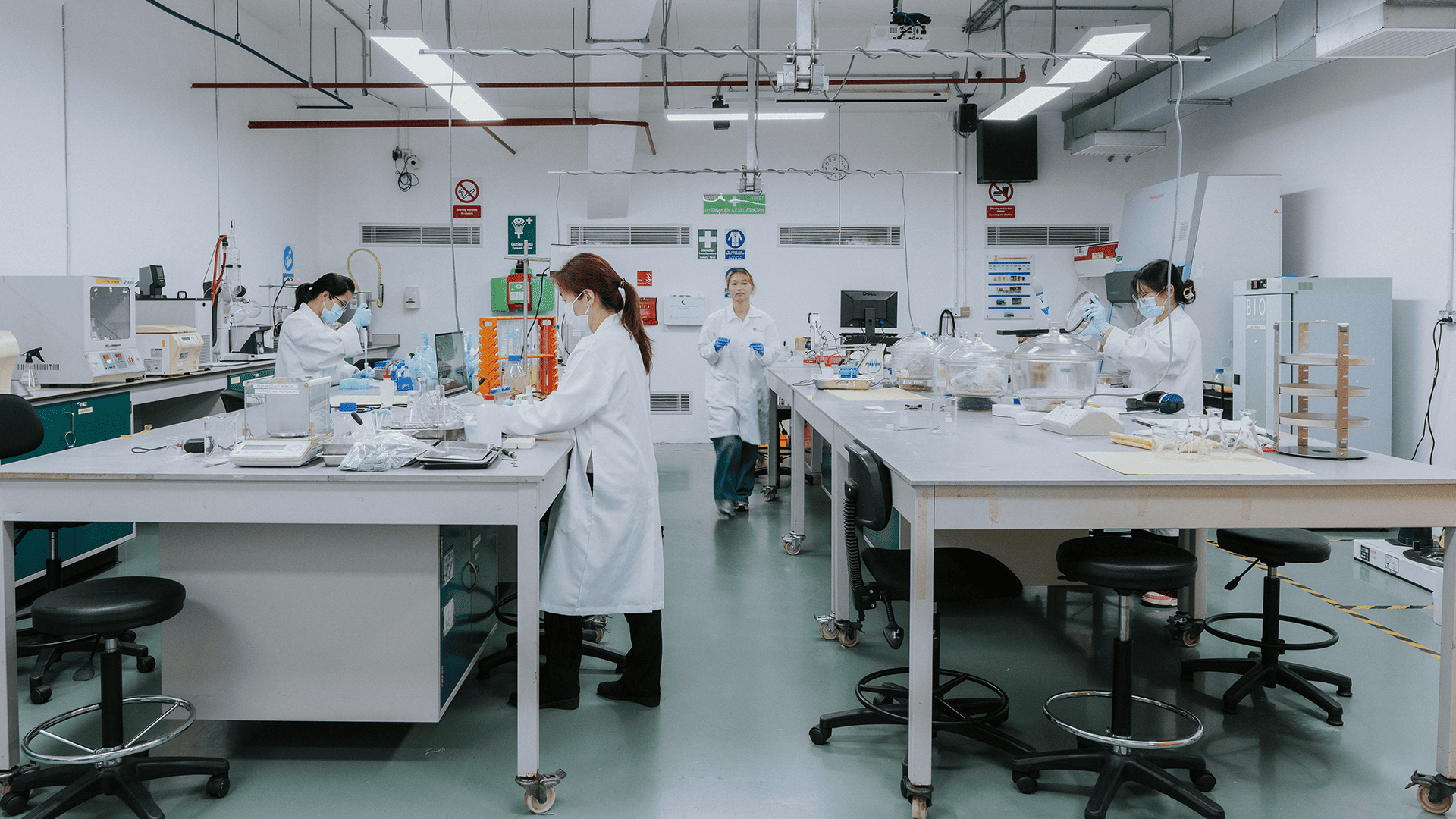 Taylor's chemical engineering student working in the lab