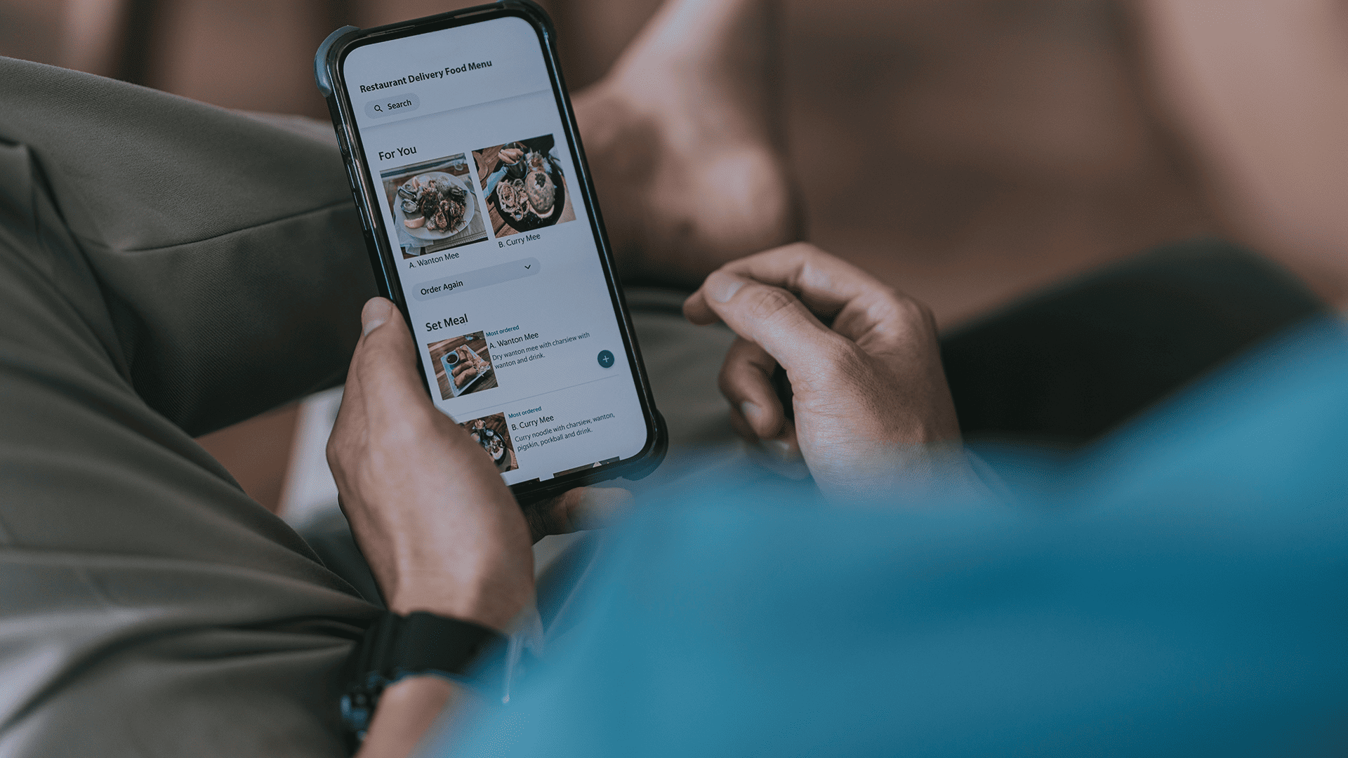 Close-up photo of a man ordering food through online