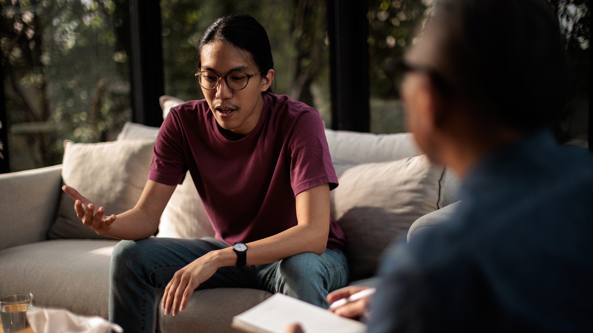 Young asian having discussion with mental health counsellor