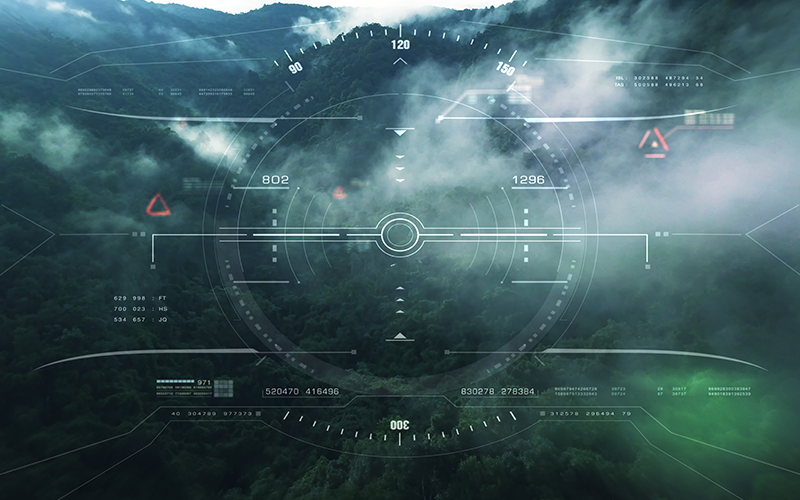 Aerial view from the fighter plane's cockpit flying over the low cloud cover mountain scape with head up display acquire targets and enemies location hidden in the dense mountain forest