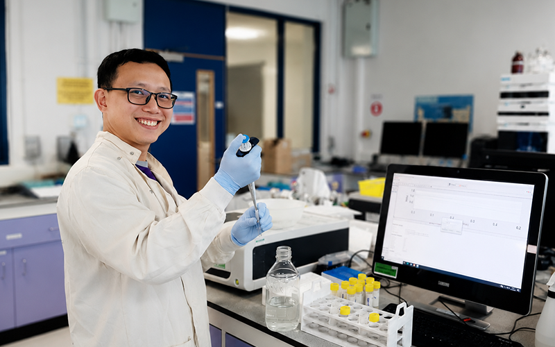 Dr Foo happy in the lab