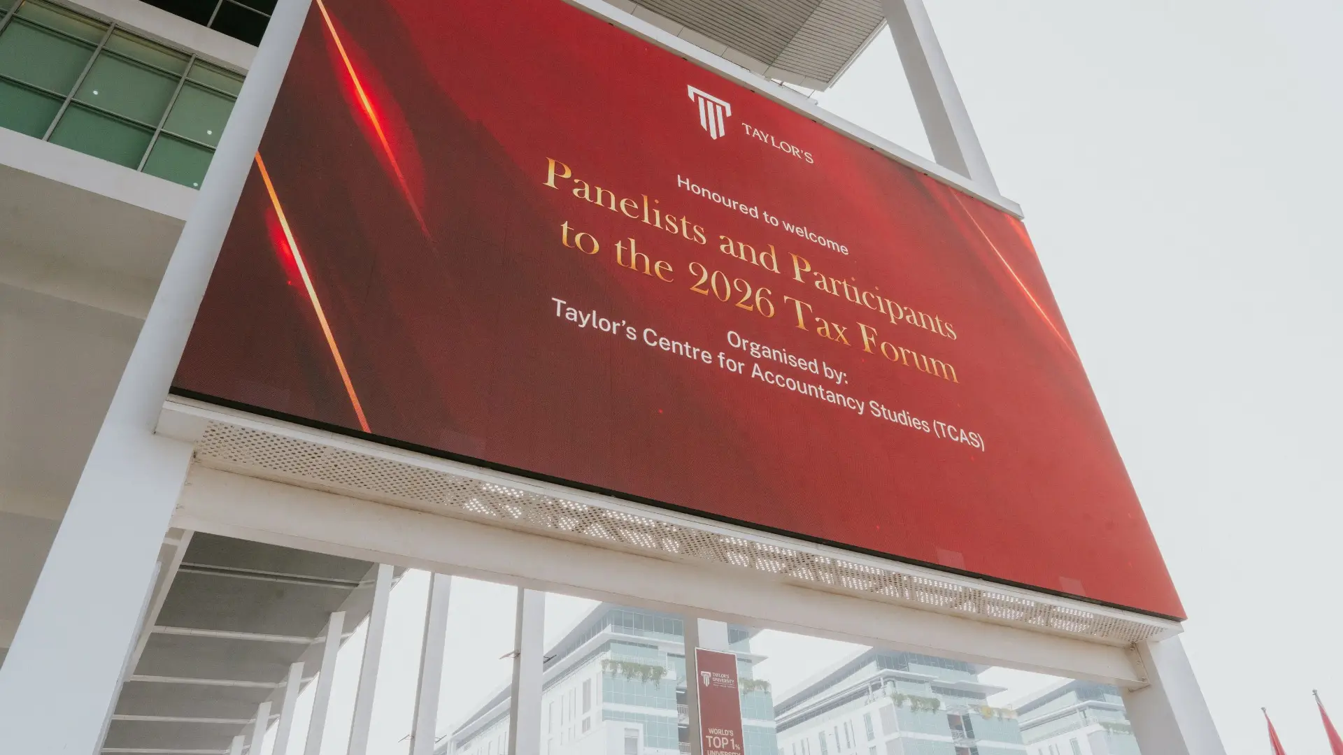 Digital billboard at Taylor's University welcoming panellists and participants to the 2026 Tax Forum, organised by Taylor's Centre for Accountancy Studies (TCAS)
