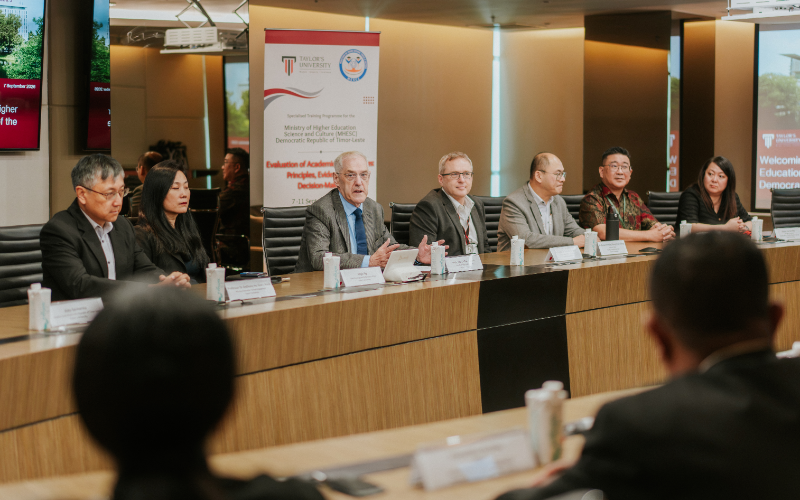Delegates from MHESC and Taylor’s University seated around a boardroom table during the opening session of the training programme