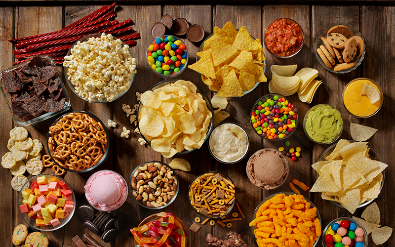Photo showing all the sweet food including potato chips, cakes and more