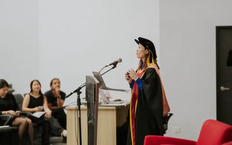 Professor Chong speaks at the lectern during her inaugural lecture