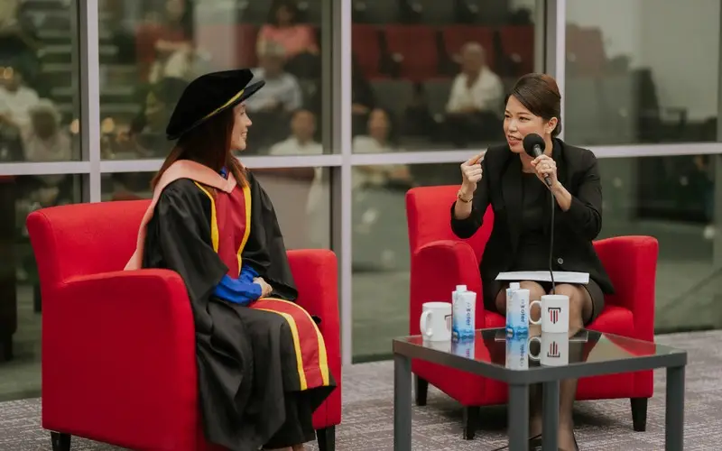 Professor Chong in conversation with the host during the lecture's dialogue session