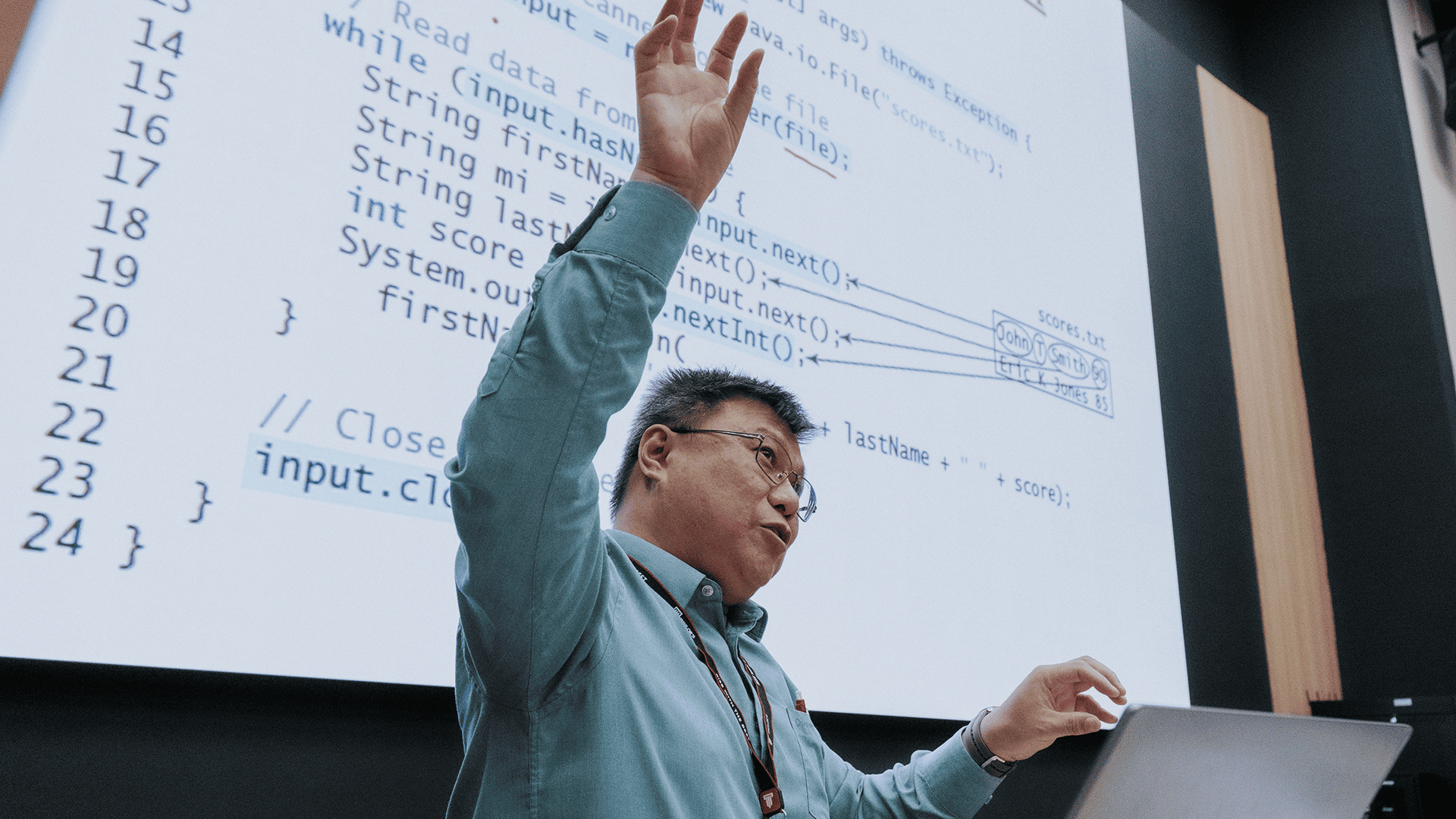 Taylor's computing lecturer teaching coding using Java