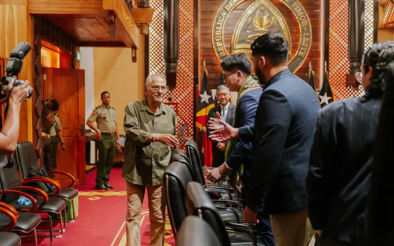 Members of the Taylor's delegation being greeted in a hall at the Nicolau Lobato Presidential Palace in Dili