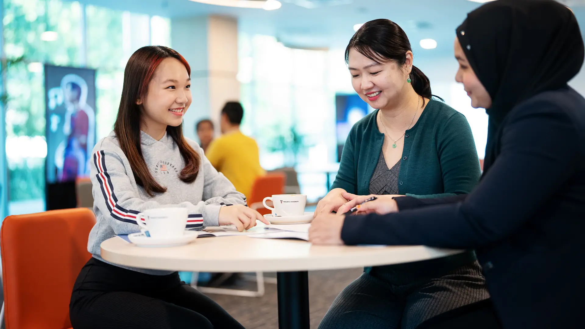 student receiving advice from 2 counselors