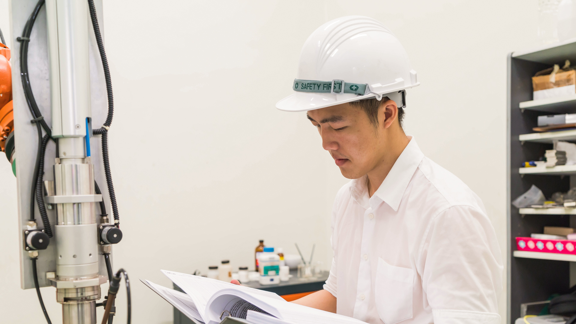 Taylor’s student reviewing construction plans in a laboratory setting