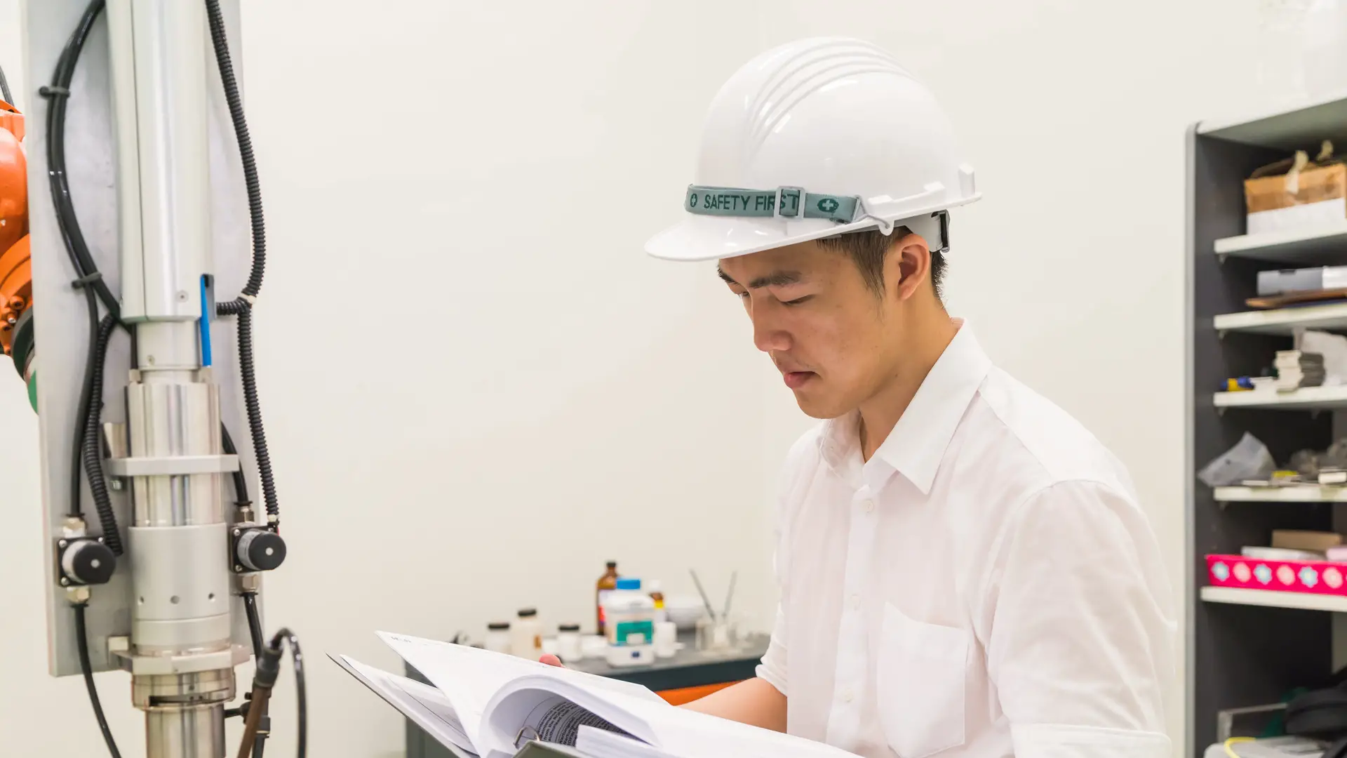 Taylor’s student reviewing construction plans in a laboratory setting