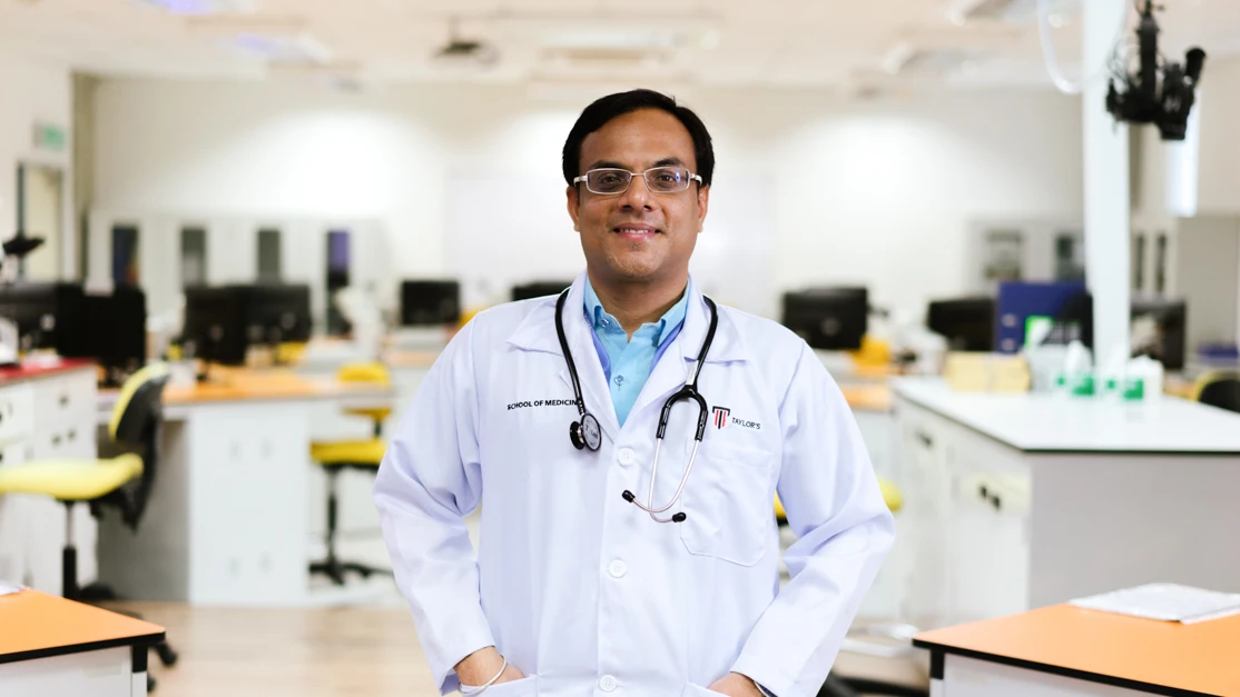 Taylor's bioscience professor in the research lab