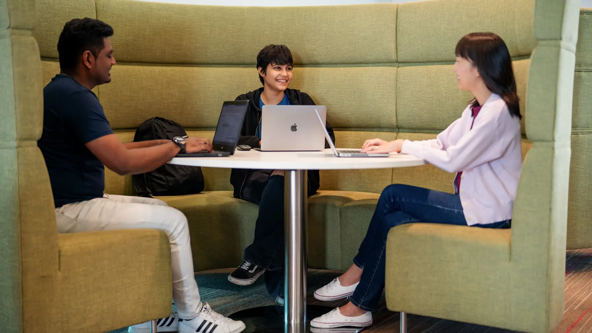 Taylor's student having discussion inside library