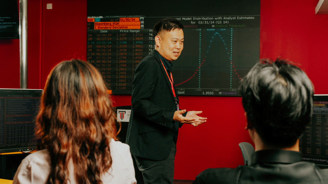 Taylor's lecturer teaching in trading room