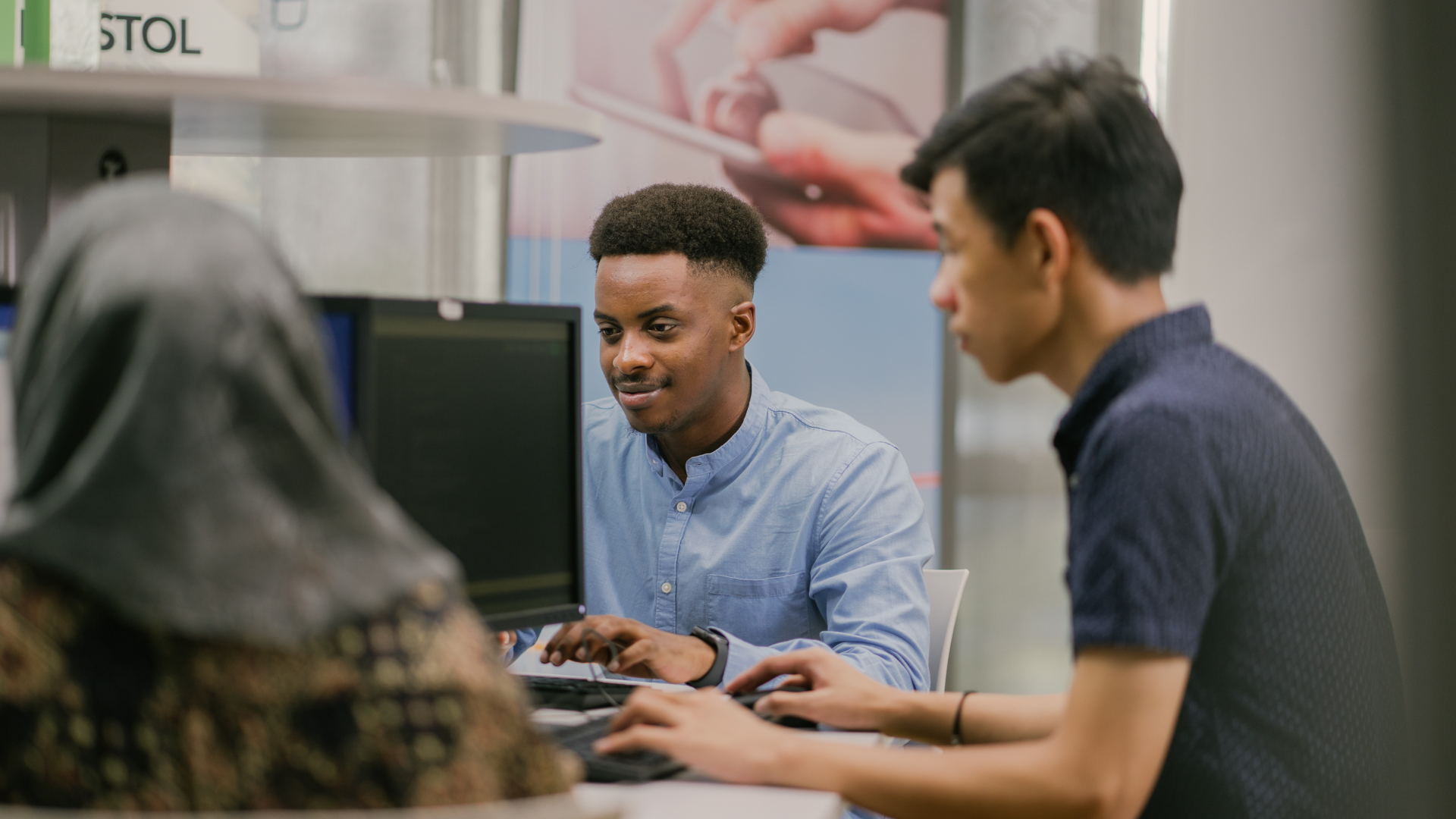 Taylor’s master's computing students working on project in computer laboratory together