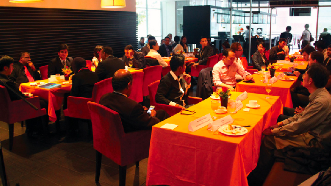 Industry leaders networking during luncheon