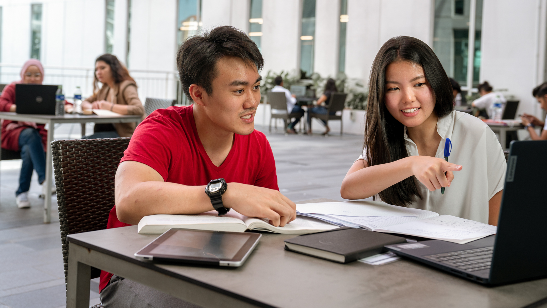 Master of Teaching and Learning students collaborating during an online learning session on campus