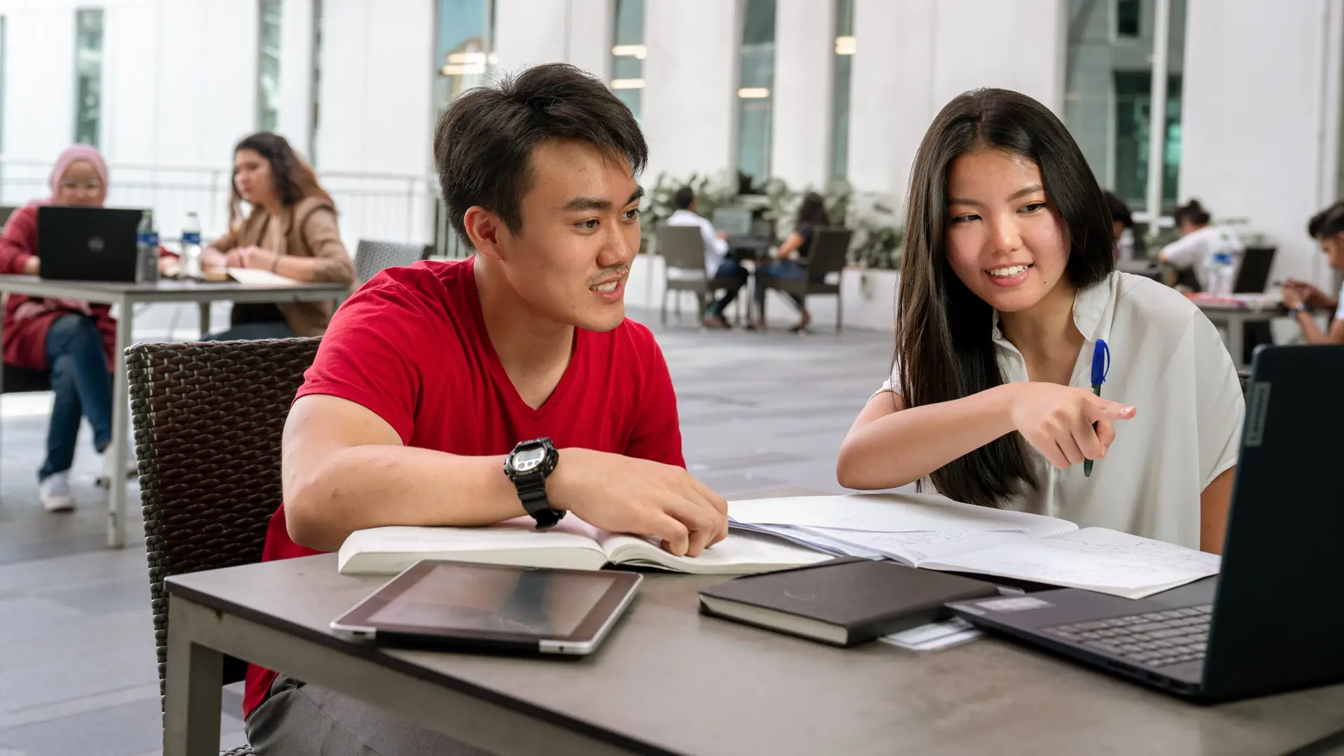 Master of Teaching and Learning students collaborating during an online learning session on campus