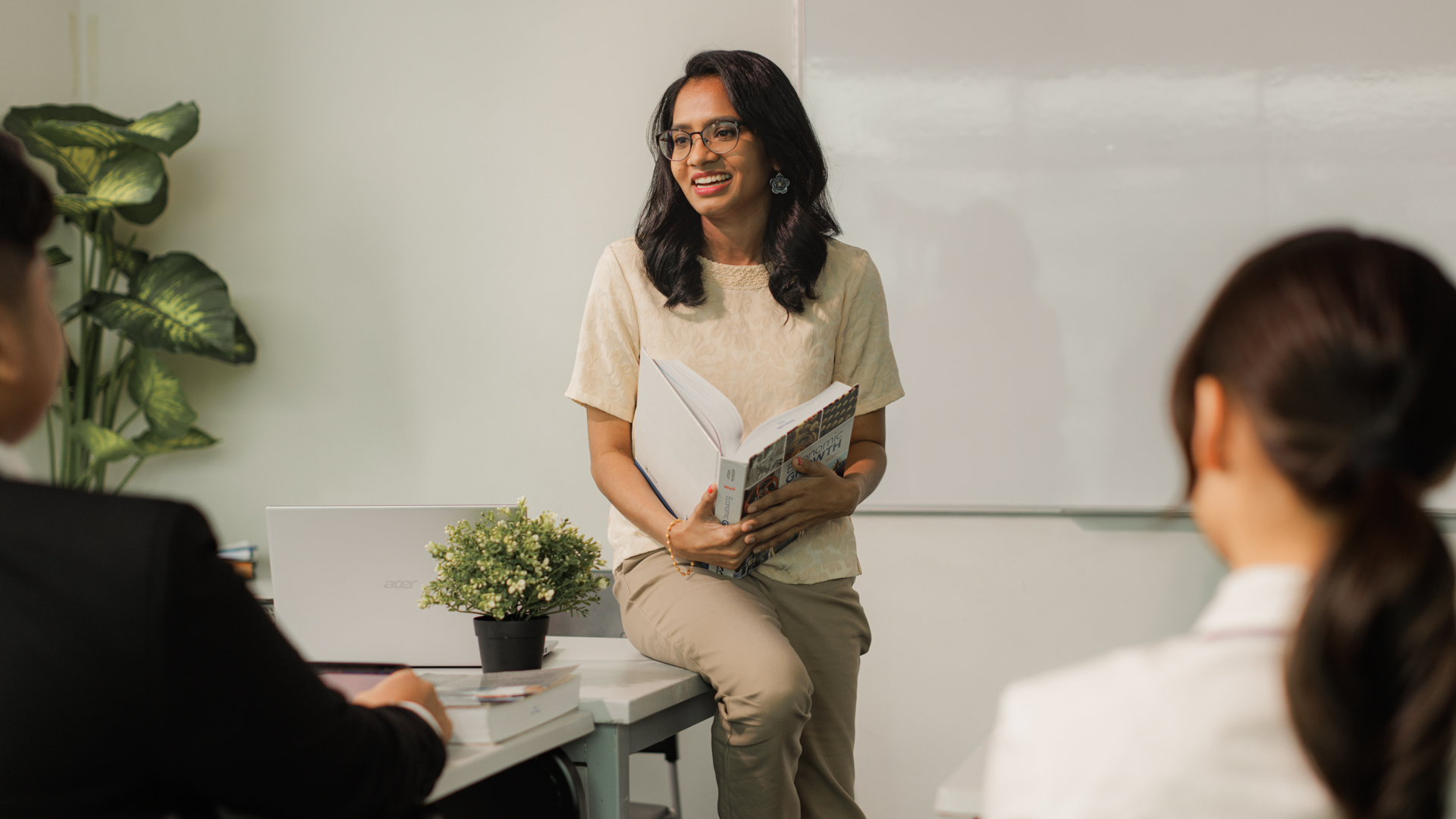 Doctor of Philosophy in Education candidate leading a discussion in a classroom setting