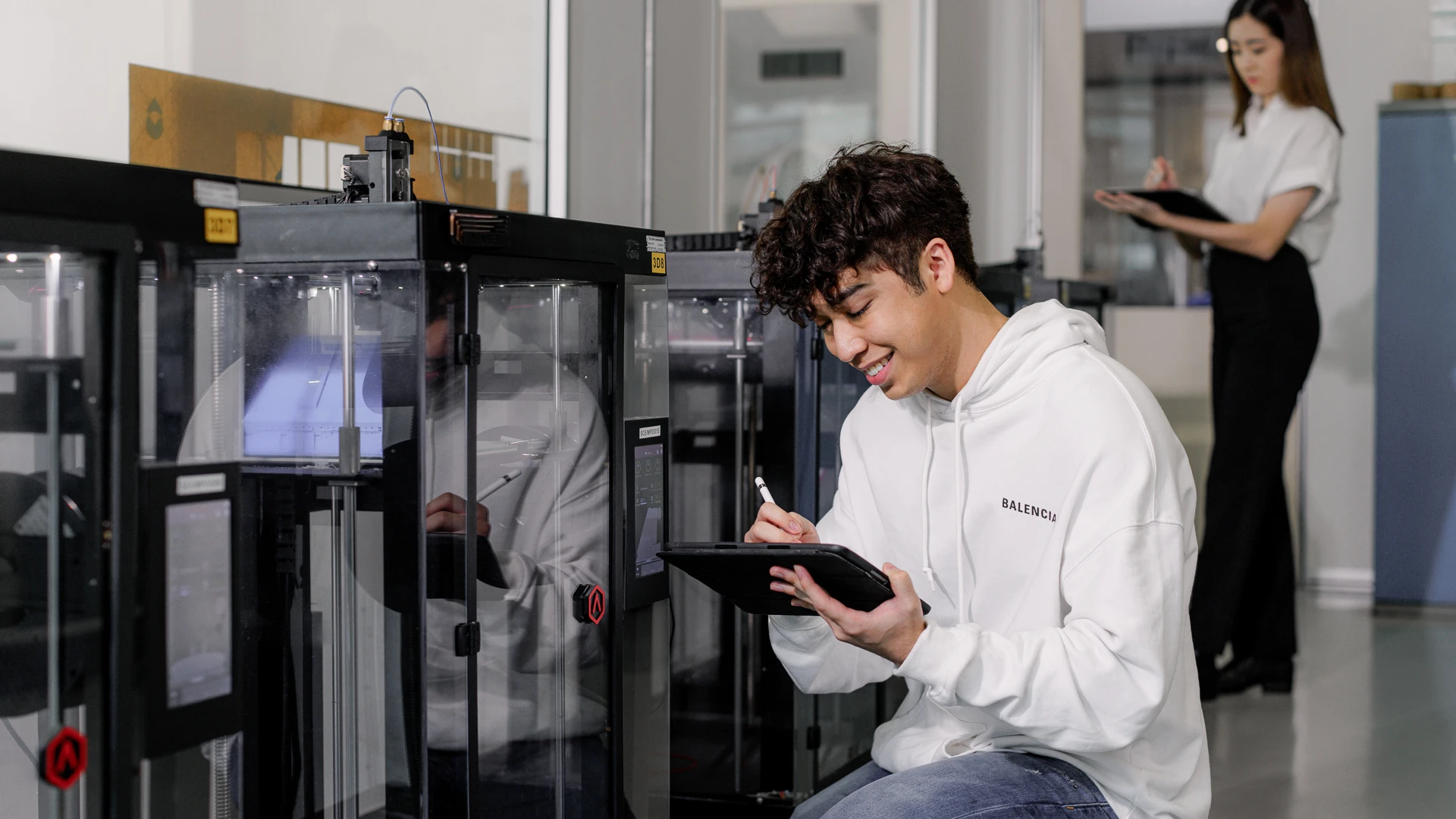 Taylor's engineering student checking on the status of the device