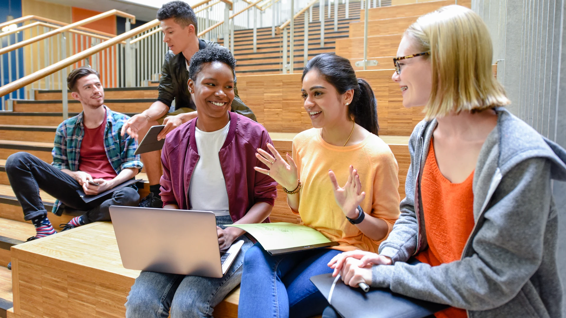 Taylor's engineering student engaging in a conversation with other students
