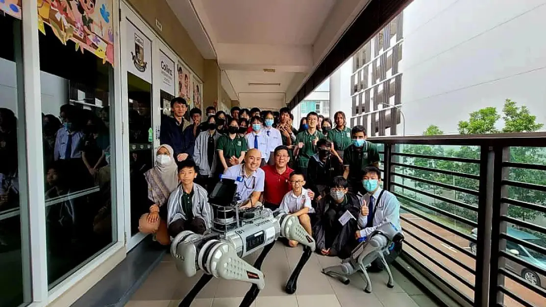 Taylor's engineering lecturer engaged in a discussion with students