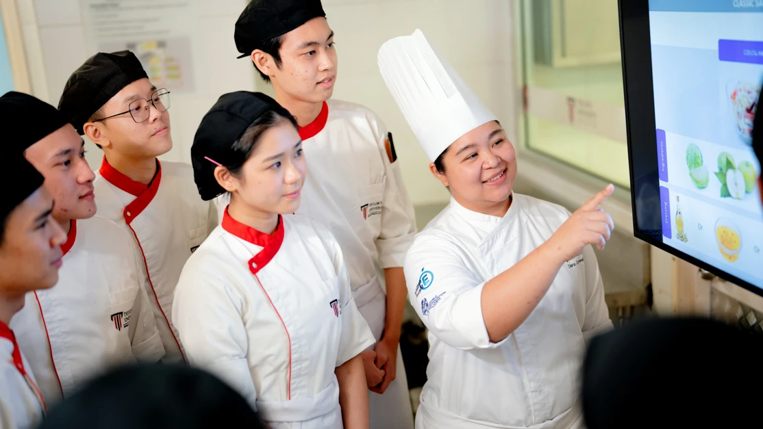 Tayor's culinary students sharing the latest research on food studies with peers during internship