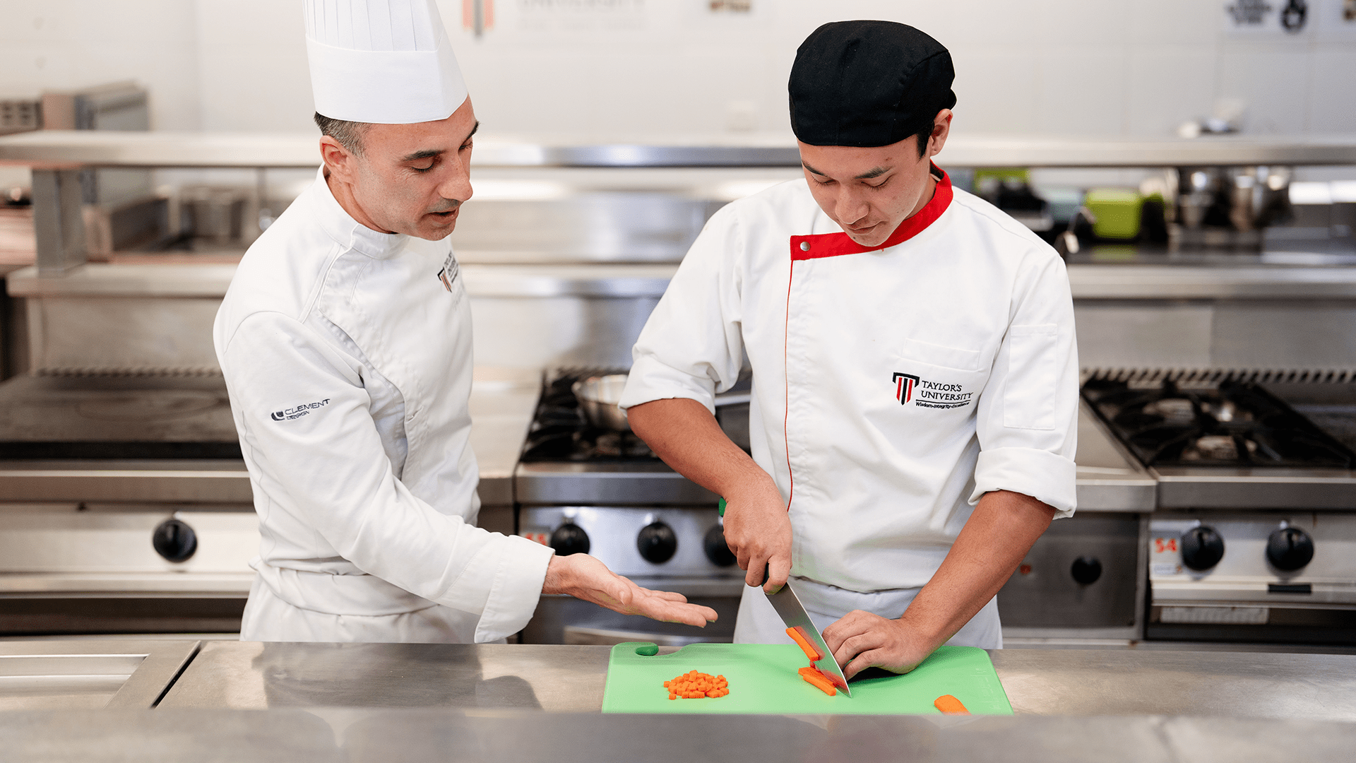 Taylor's culinary institute lecturer guiding student on the preparation of the ingredient