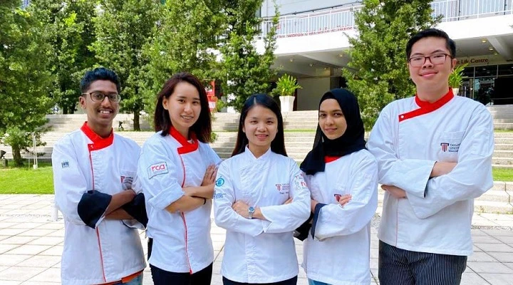 4 culinology® students posing for a group photo