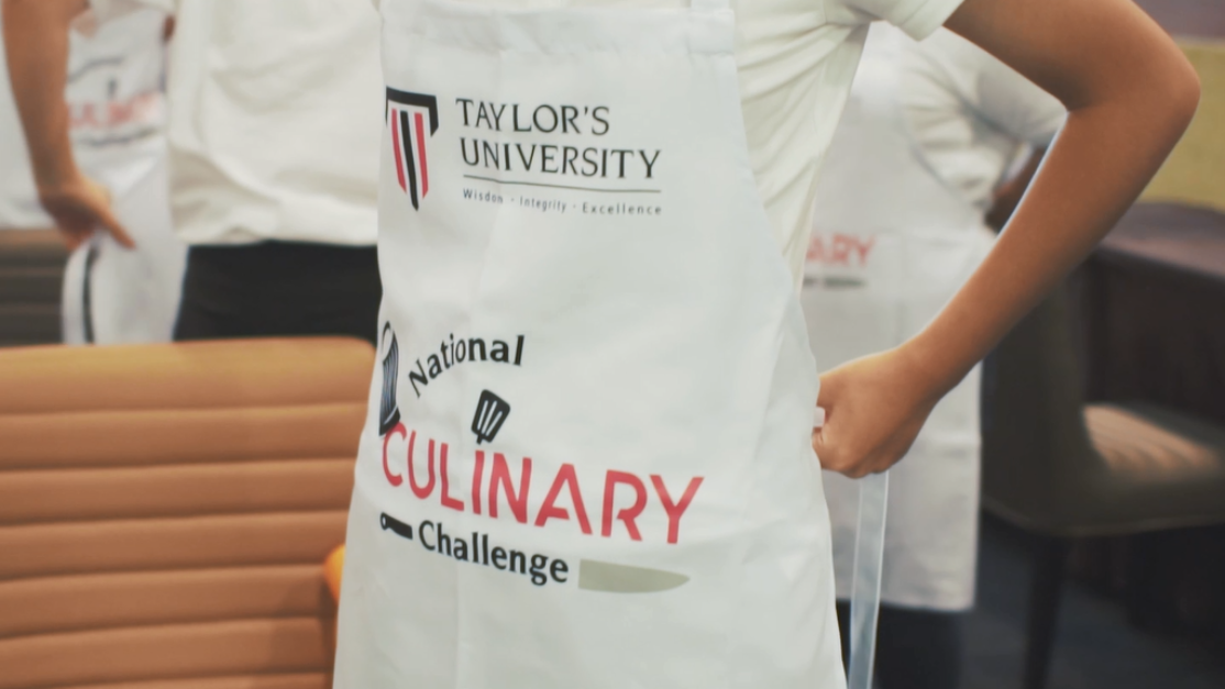 student tying up his apron