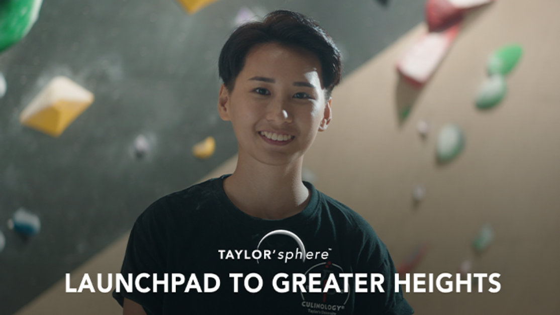 taylors student with a rock climbing wall background
